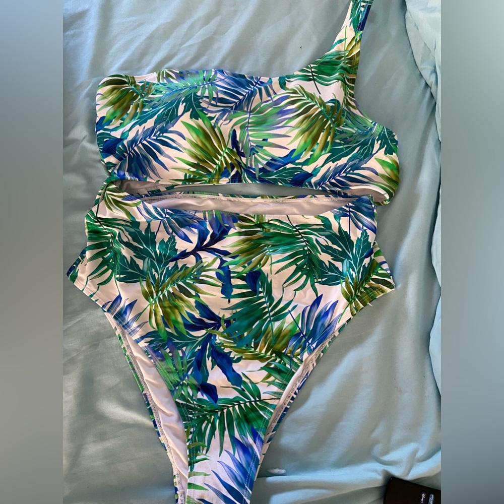 Tropical print swimsuit with skirt.